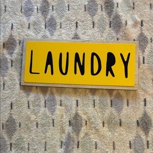 Yellow Wooden Laundry Sign
